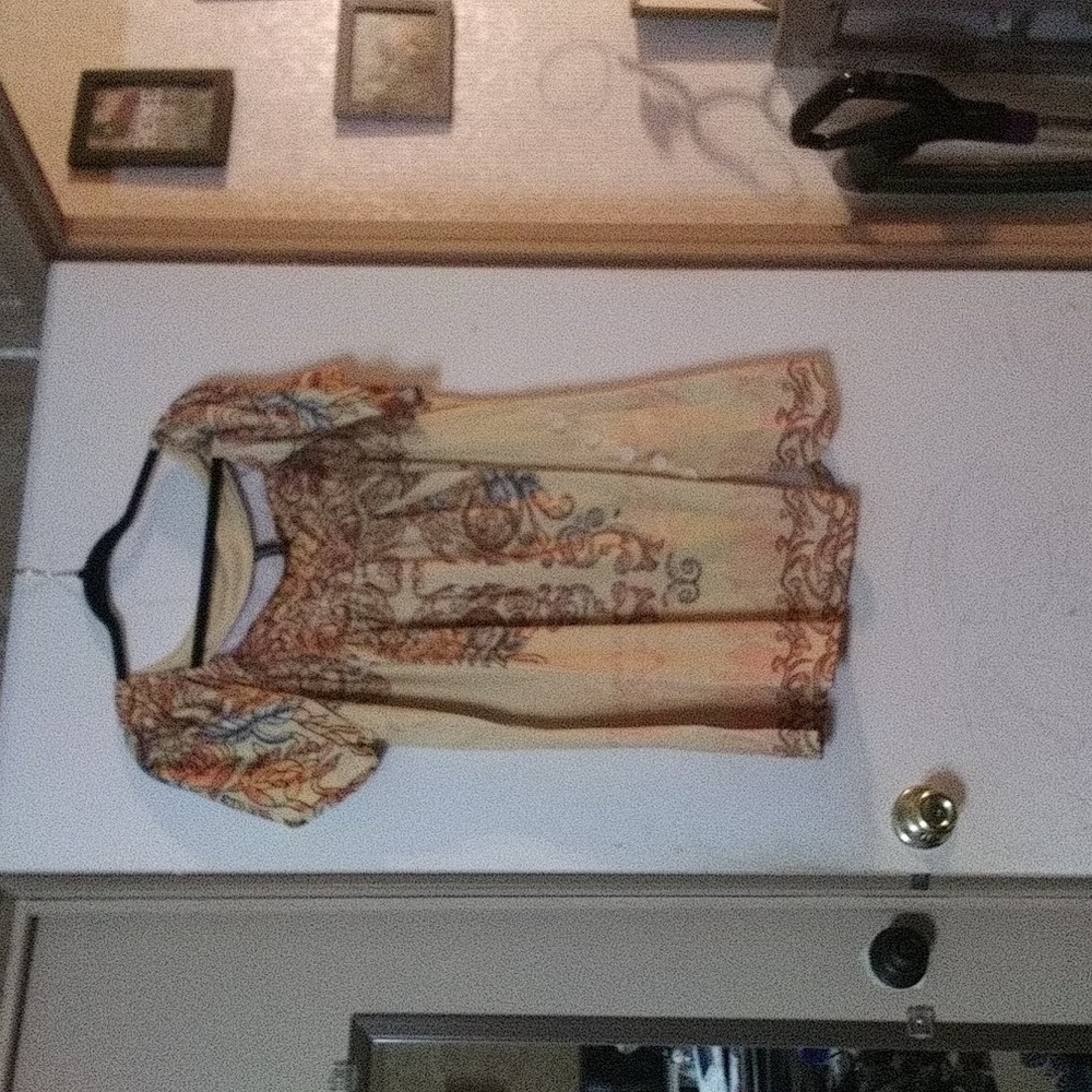 Lightweight shirt with red, orange, green, and white vine/flower design